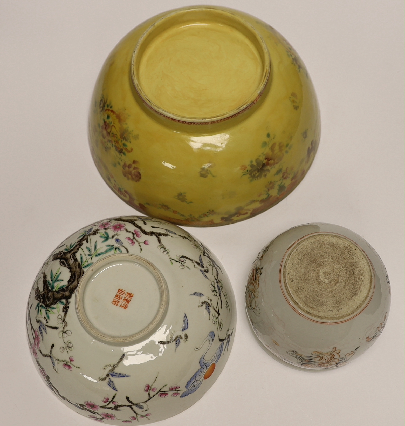 Two Chinese famille rose bowls and a small jardiniere